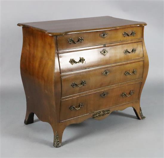 A 19th century Dutch ormolu mounted mahogany bombe commode, W.2ft 10in. D.1ft 8in. H.2ft 5in.
